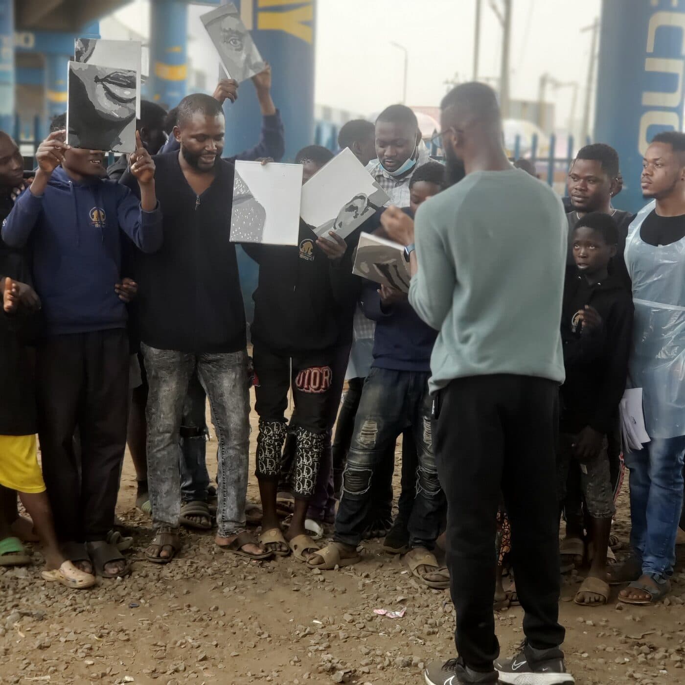 Children presenting their sketches, Mokola underbridge, Ibadan, Emmanuel Anaiye Ifebunmi art