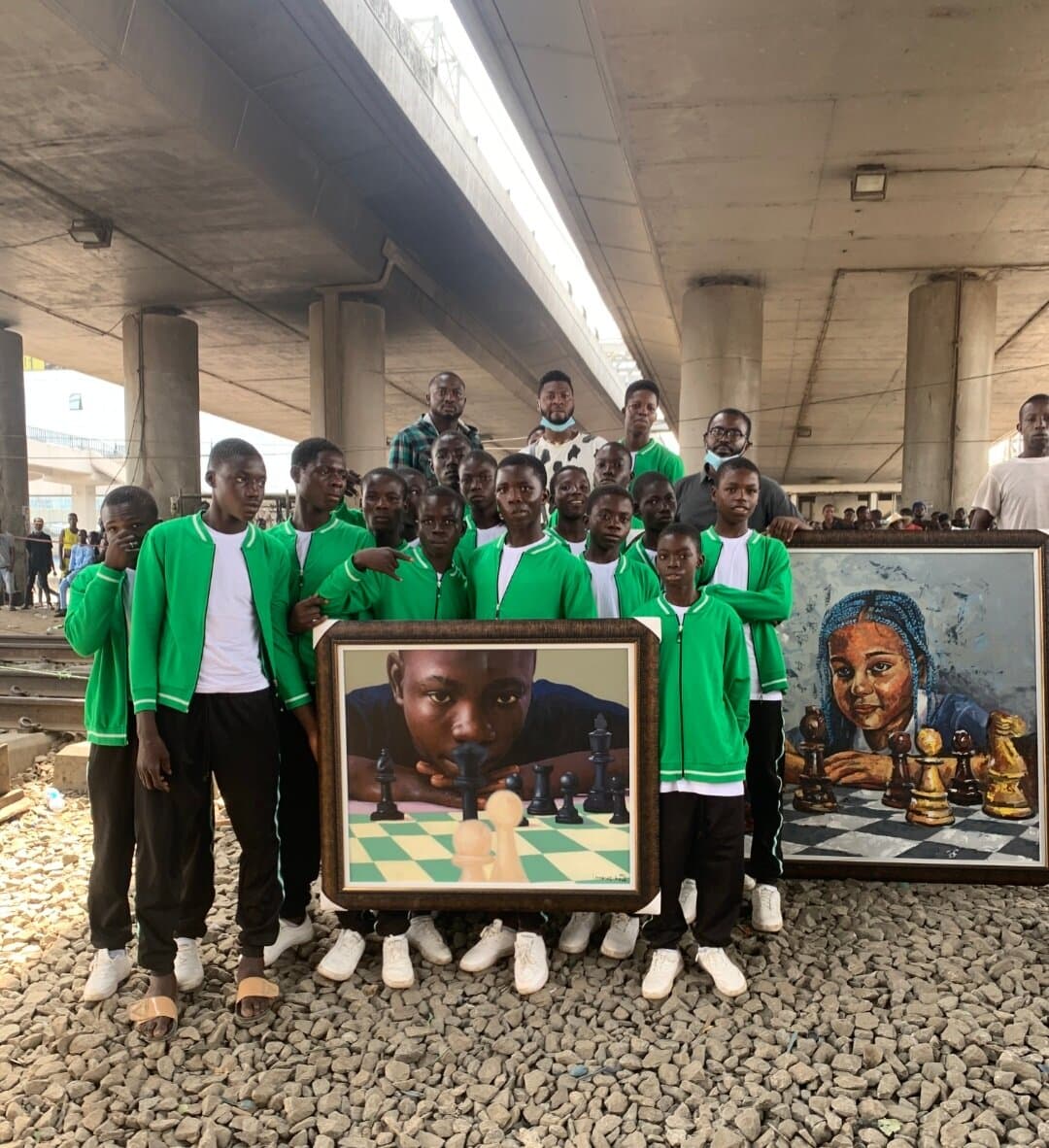 With participants and their chess-themed portraits, Chess Beyond Borders, Oshodi, Emmanuel Anaiye Ifebunmi art