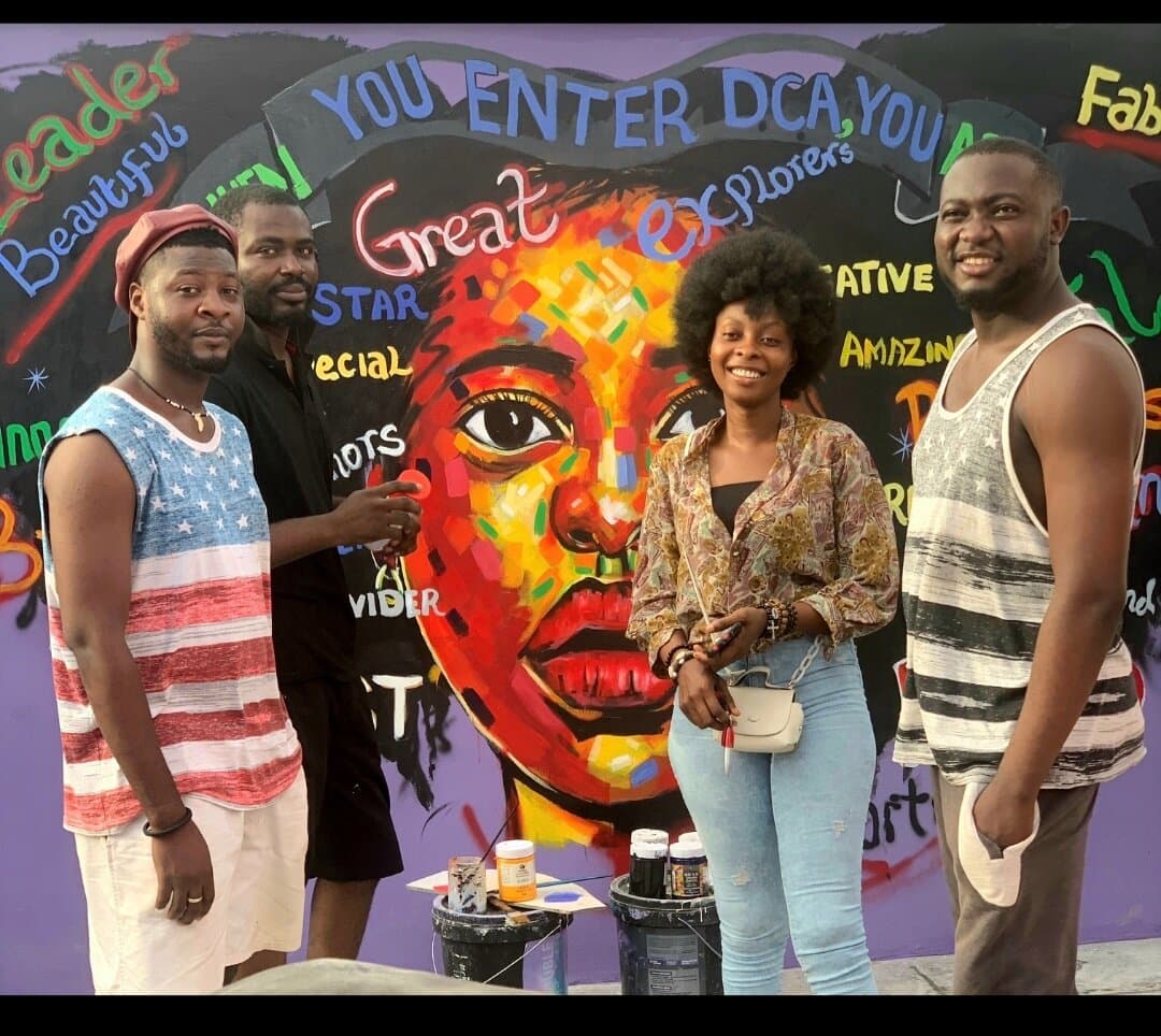 With the team in front of the finished Dream Catchers Academy mural, Emmanuel Anaiye Ifebunmi art